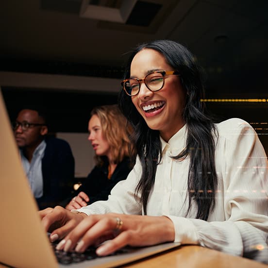 Woman Happy with Work on Computer_552x552 (1).jpg